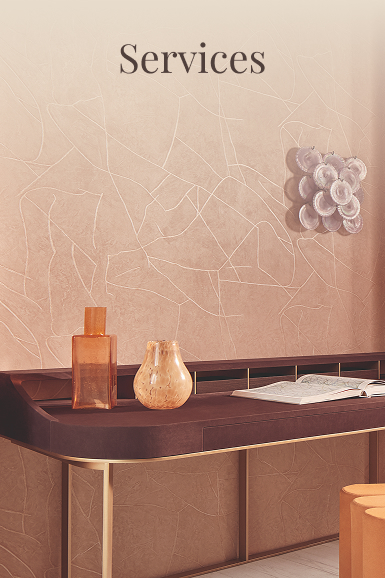 Decorative furniture with design objects and textured wall in warm tones