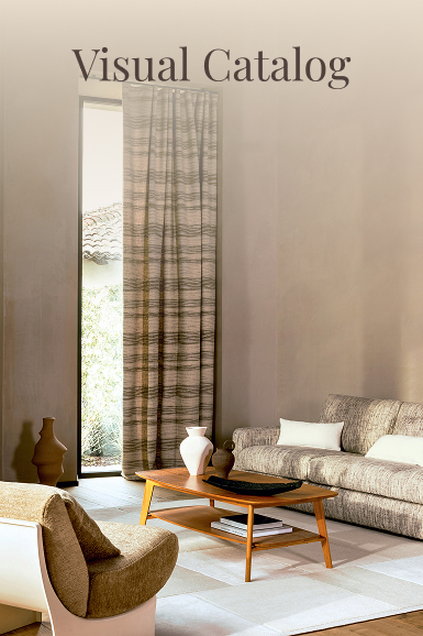 Elegant living room with natural light, long curtains, and modern furniture